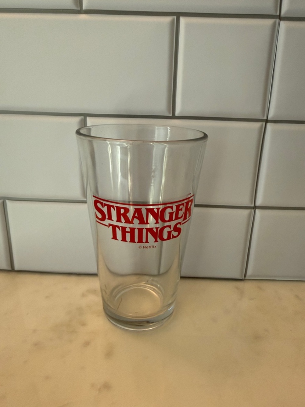 Stranger Things Red Logo Pint Glass - Official Netflix Drinkware